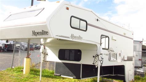 You can reach it by turning the <strong>wheels</strong> all the way to the left, and sliding under the car behind the passenger side front tire. . Alpenlite 5th wheel owners manual